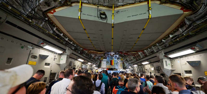 Visitors aboard a USAF C-17 at the 2018  Berlin Air and Trade Show.