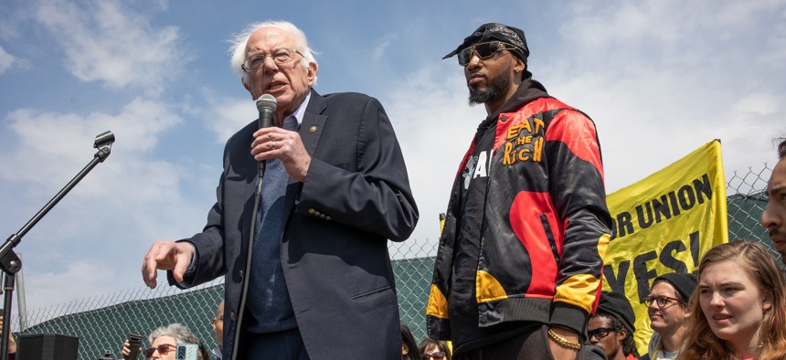 Sen. Bernie Sanders speaks alongside Amazon labor organizer Chris Smalls at an April 24, 2022 rally in Staten Island, N.Y. on the eve of a union election at an Amazon facility.