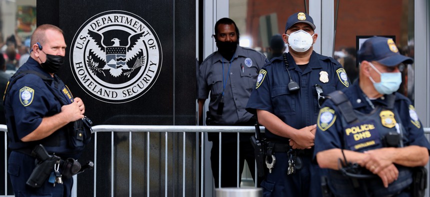 Security officers observe a protest outside ICE headquarters on September 21, 2021.