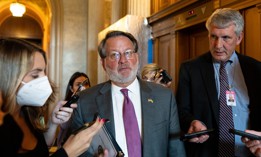 Sen. Gary Peters  speaks with reporters as he leaves the Senate Democrats weekly lunch in the Capitol on May 24, 2022.