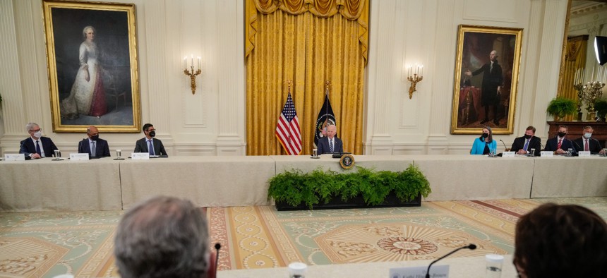 President BIden hosts an August 2021 meeting on cybersecurity in the East Room of the White House
