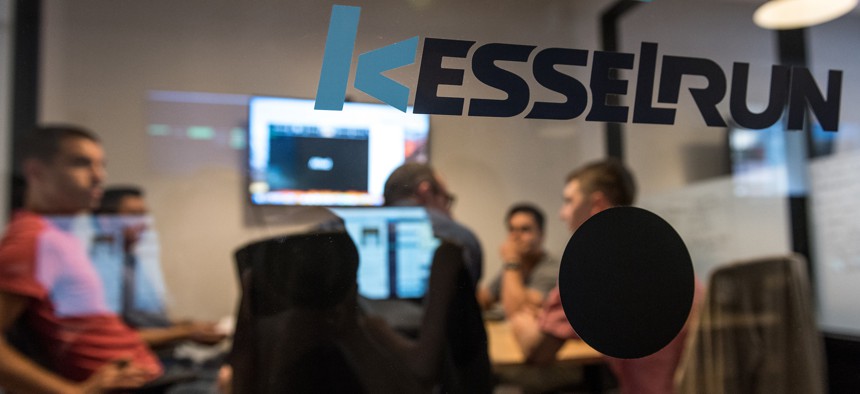 A software development team meets about a project in the office of Kessel Run in Boston on May 30, 2018.