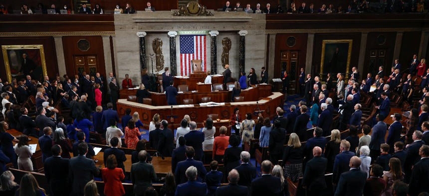 Members of the 118th Congress stand for the Pledge of Allegiance on the first day of the 118th Congress in the House on Jan. 3, 2023. 