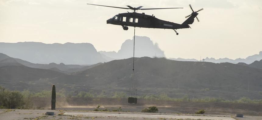 An autonomous UH-60 Blackhawk helicopter on a test flight at the Army's Yuma Proving Ground as part of Project Convergence 22, held last fall.