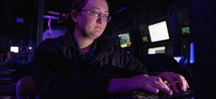 Electronics Technician 2nd Class Kattie Smith troubleshoots a computer system aboard the Freedom-class littoral combat ship USS Sioux City (LCS 11) while transiting the Atlantic Ocean, Aug. 17, 2022.